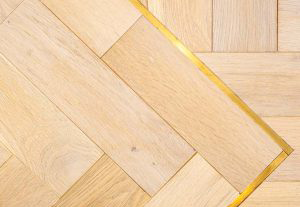 brass-design-strip-woodpecker-flooring-300x300