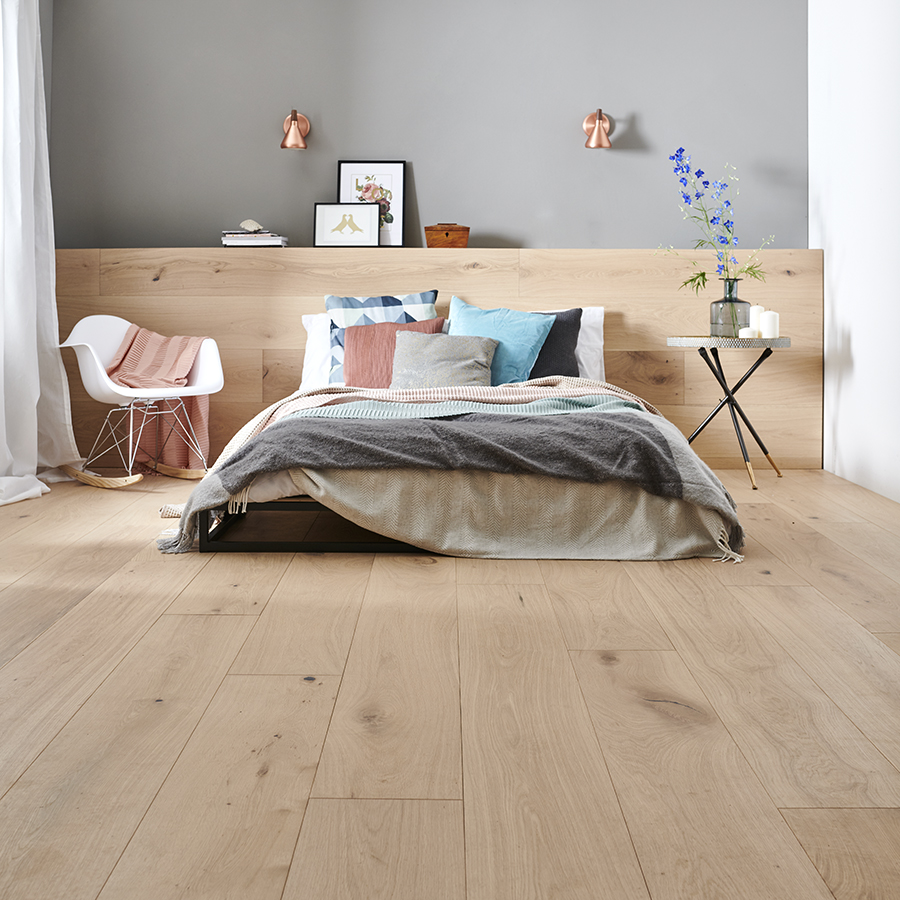 wide wood flooring in a bedroom