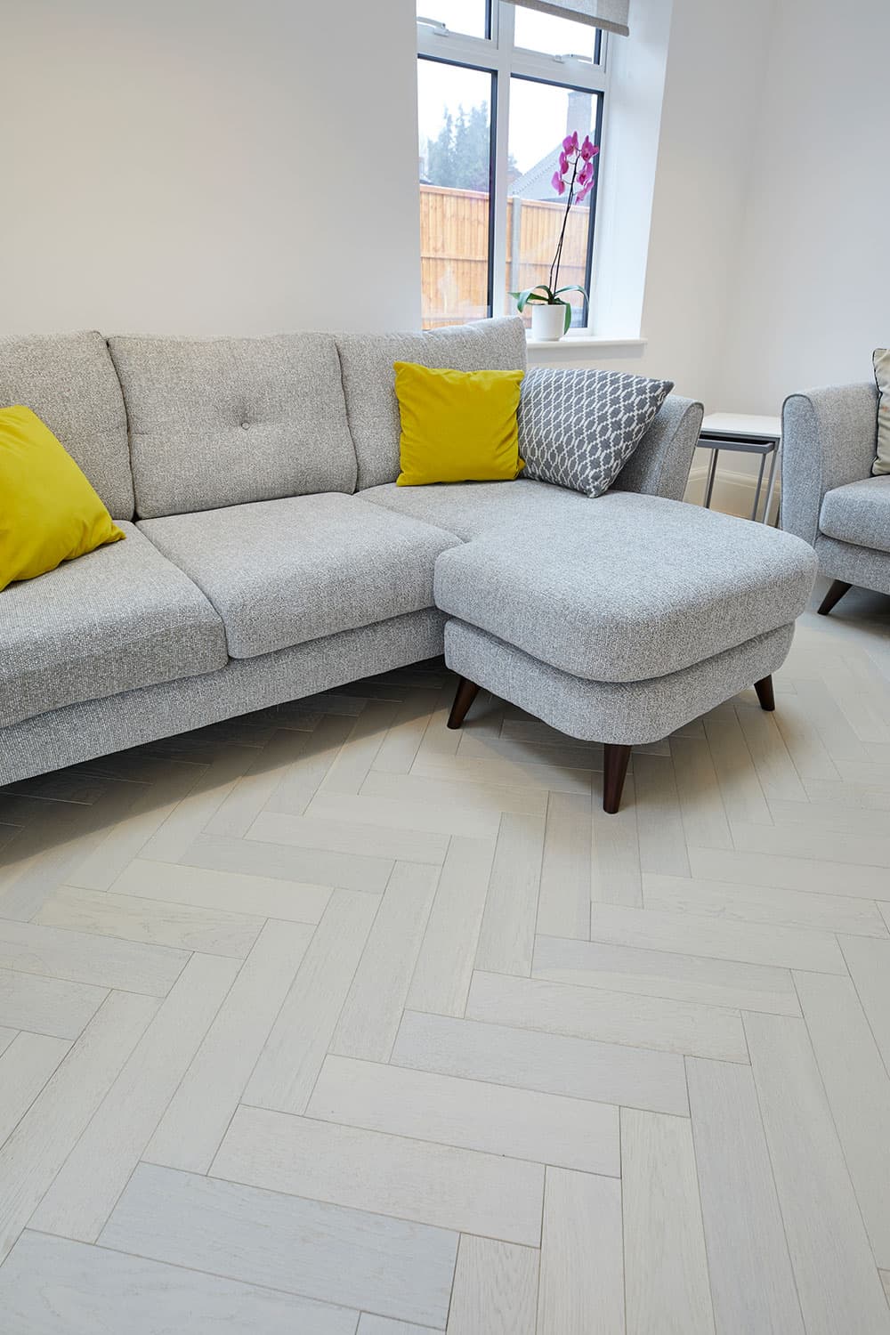 white oak flooring with grey sofa