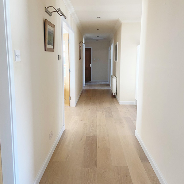 Engineered wood floor, 3mm wear layer in a hallway