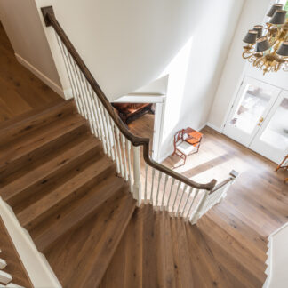Engineered wood flooring in an entry and stairs