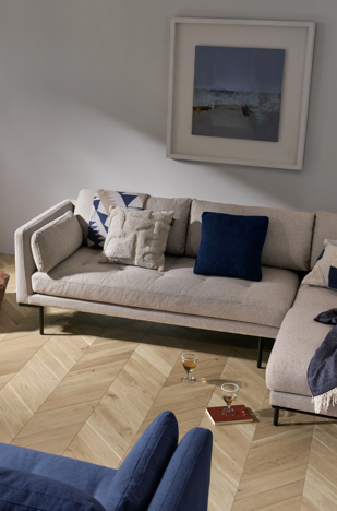 Engineered parquet flooring in a living room. Goodrich raw oak chevron
