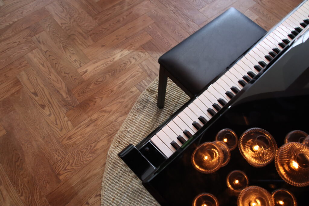 piano-with-coffee-coloured-herringbone-flooring