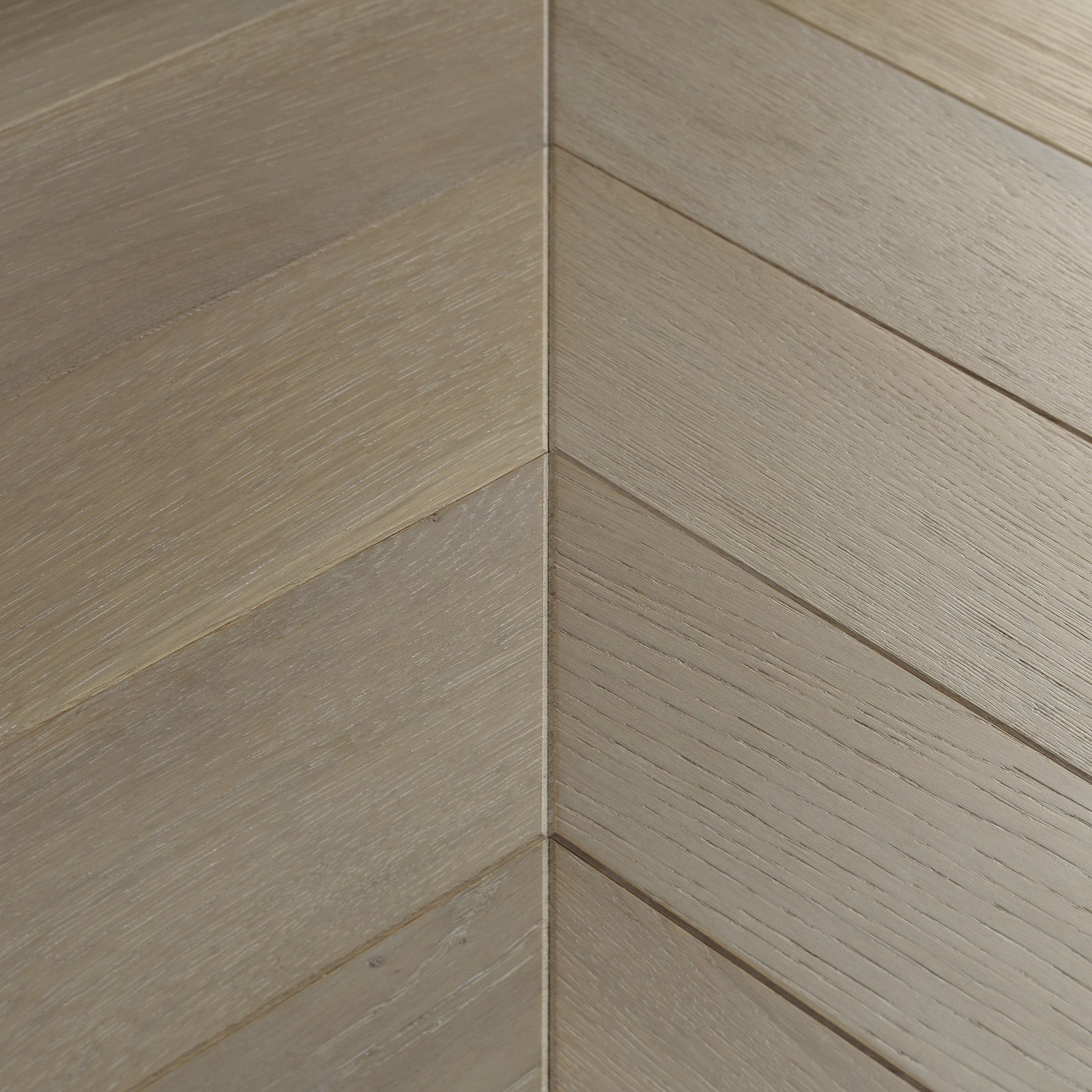 engineered chevron parquet wood flooring in grey tones